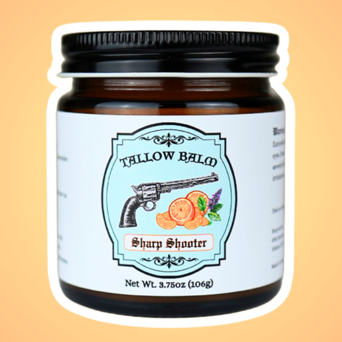 Sharp Shooter tallow balm in an amber glass jar, label shows a vintage revolver with orange slices and mint