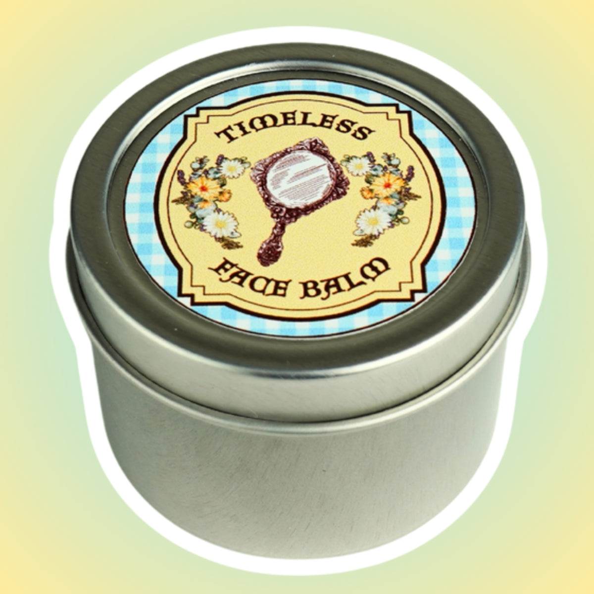 Timeless Face Balm in a 2 oz silver tin, lid label shows an antique hand mirror framed by daisies on blue gingham