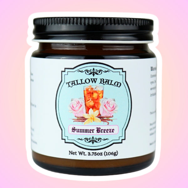 Summer Breeze tallow balm in an amber glass jar, label shows iced tea with pink roses and a vanilla flower